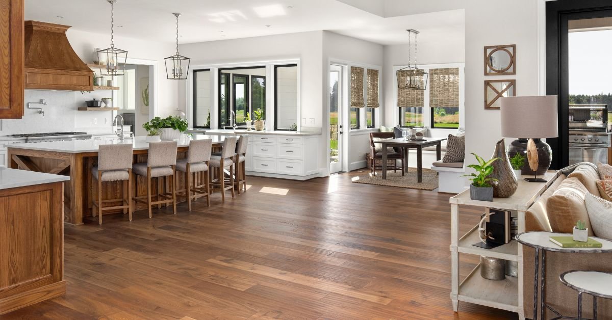 Spacious kitchen and dining area featuring modern appliances and a large table set for a meal.