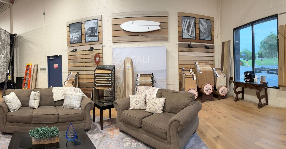 Floors USA CALI display showcasing stylish furniture and decorative pictures displayed on the walls.