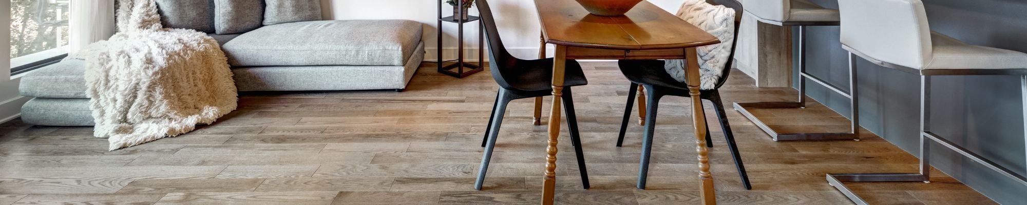 A modern living room with a sleek bar area and inviting chairs, perfect for entertaining guests.