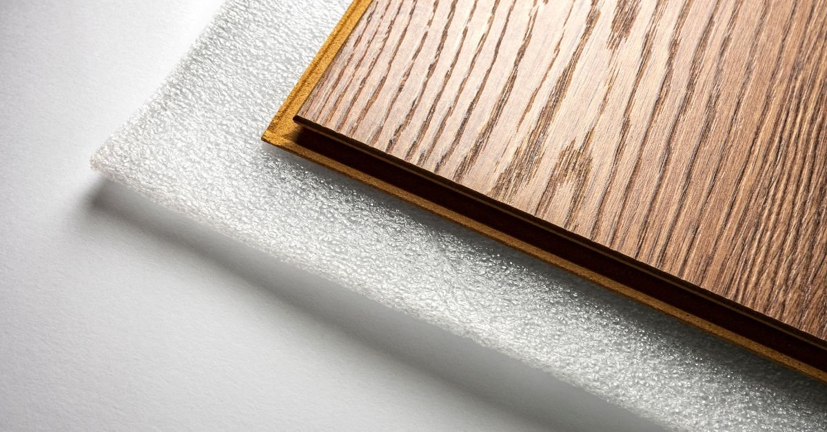 Detailed view of a wooden floor featuring a piece of foam, showcasing the natural grain and surface variations.