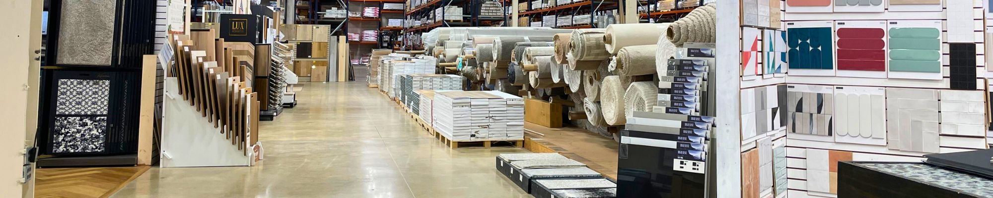 Floors USA showcasing a variety of flooring options, including tiles, hardwood, and carpets displayed in an organized manner.